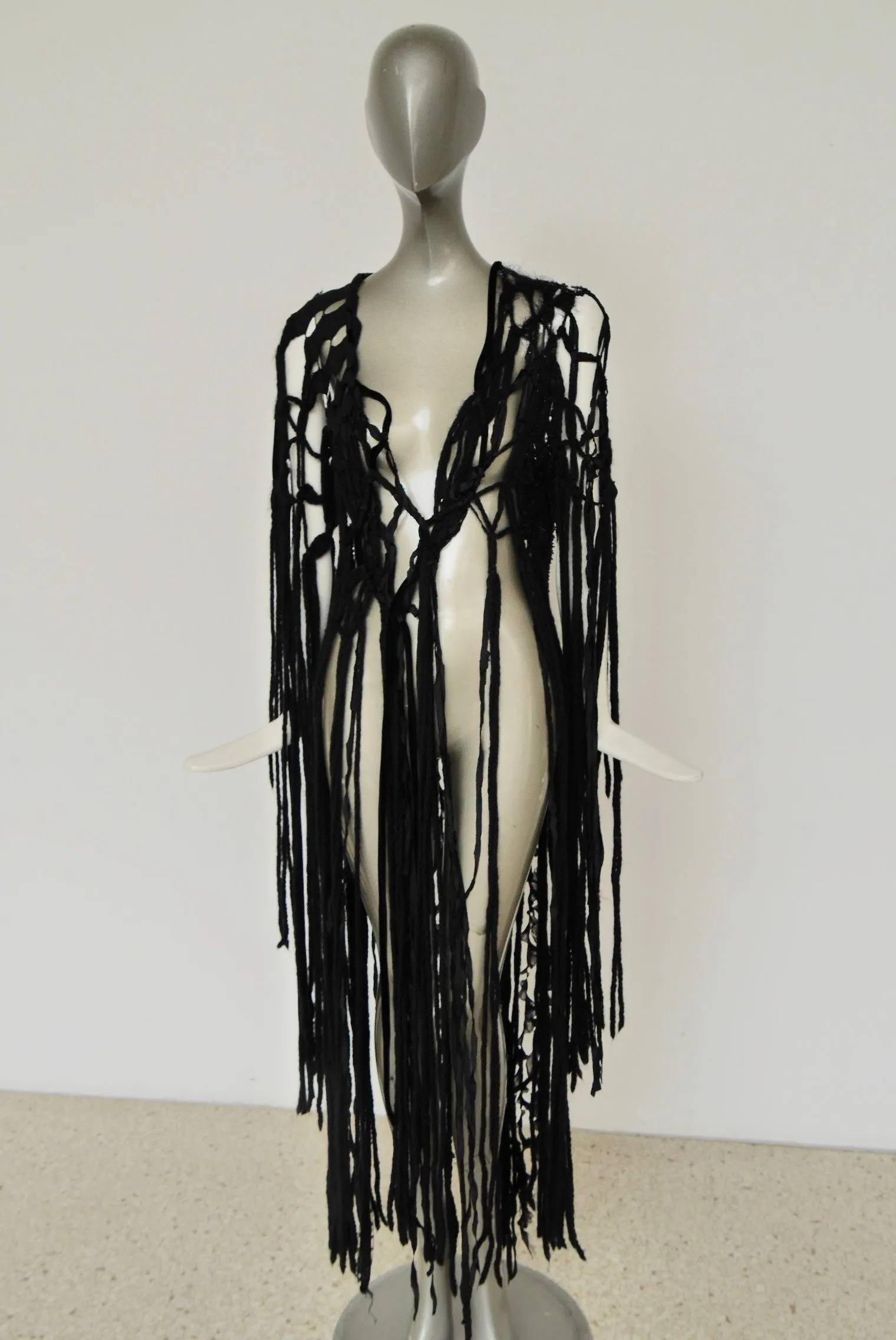 Slashed Bohemian style knit vest by Rodarte